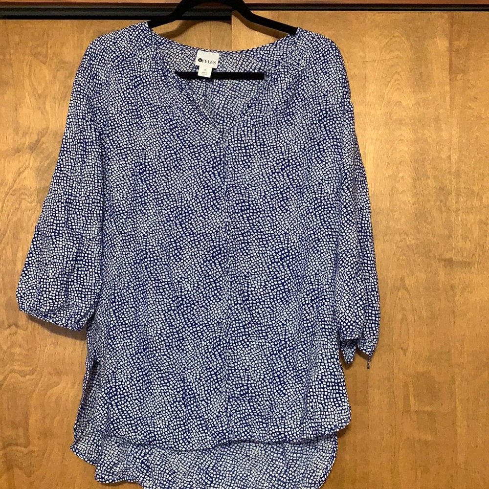 Blue and white patterned blouse. 3/4 length sleeves.